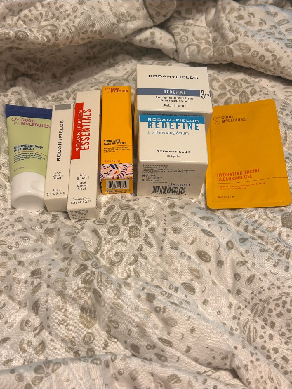 Rodan + Fields Skincare Trio with White and Orange Packaging